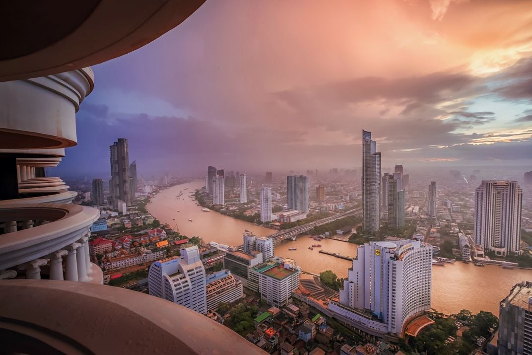 8 - A bird’s-eye view captures the skyline of the country’s capital city as the sun peeks out from the clouds.