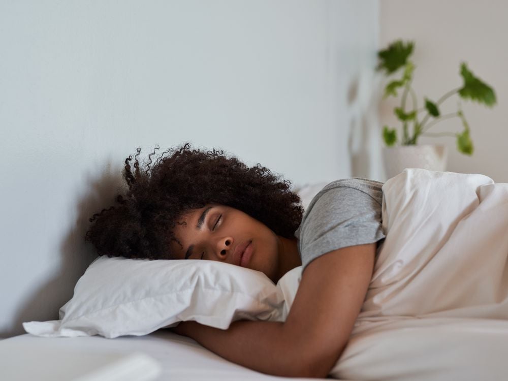 A young women asleep in bed