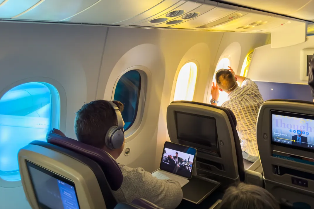 People taking eclipse photos from an airplane