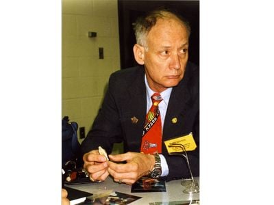 William Maples holds a bone fragment during a presentation about the Romanov Investigations, circa 1992.