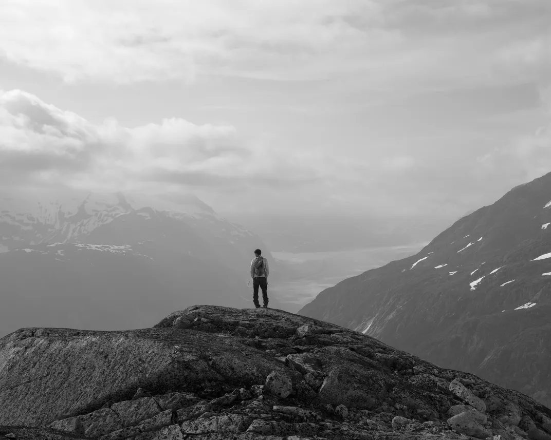 Faculty member Matt Osman, from the University of Arizona, stands on a ridge of Avalanche Canyon with Gilkey Glacier in the distance.