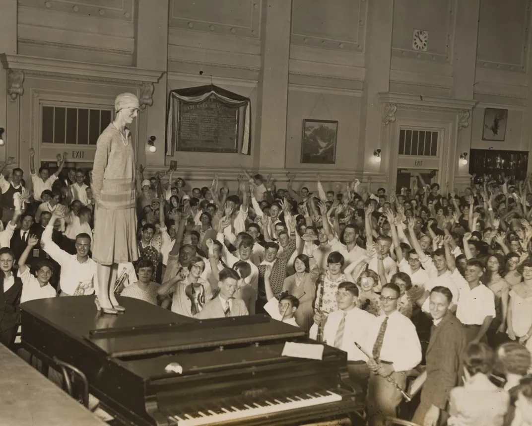 Amelia Earhart greets an adoring crowd in July 1928.