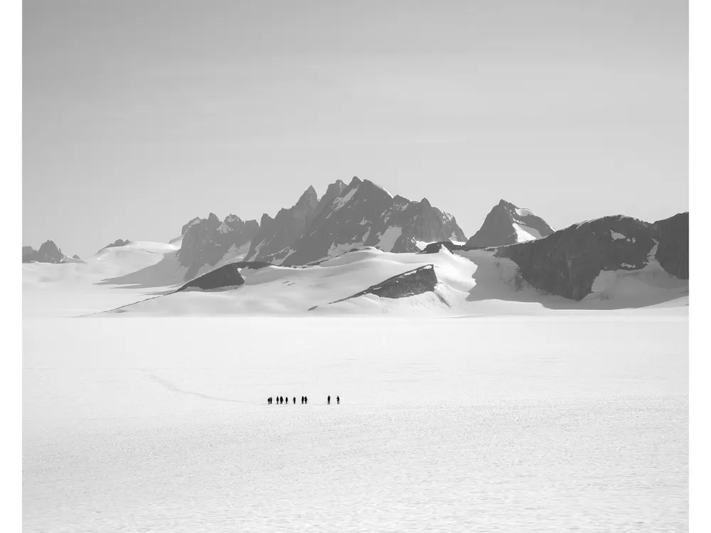 OPENER - A team skis from the remote Taku D site to the Camp 10 sleeping quarters. Students often travel as much as 8 to 10 miles a day, carrying packs a third of their body weight.