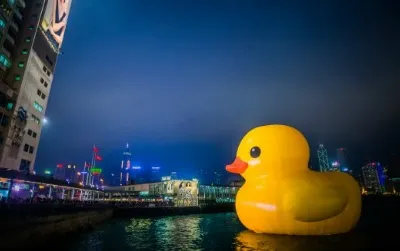 A massive inflatable rubber duck floats in Hong Kong’s Victoria Harbor, adding a flash of bright yellow to the cityscape.