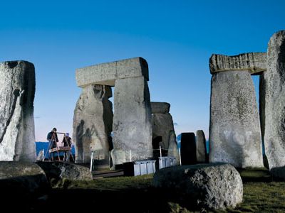 Carved sarsens-enormous blocks of hard sandstone-were used to build the towering trilithons that dominate the landscape of Salisbury Plain in southern England.  But archaeologists Timothy Darvill and Geoffrey Wainwright believe the smaller so-called bluestones hold the key to unraveling Stonehenge's mystery.